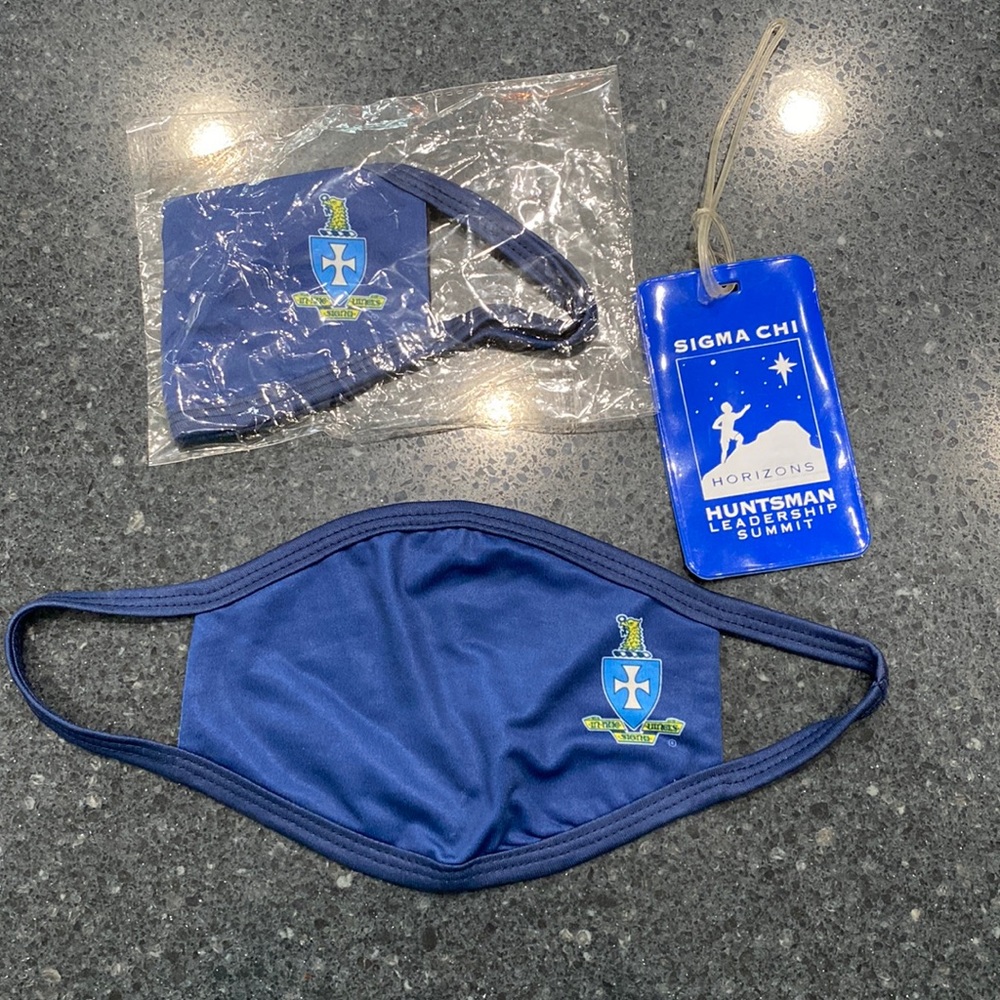 Sigma Chi Fraternity items. 2 face masks (1 unopened) and 1 luggage unused tag.